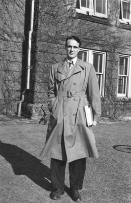 Man standing in front of Willison Hall, Waterloo College