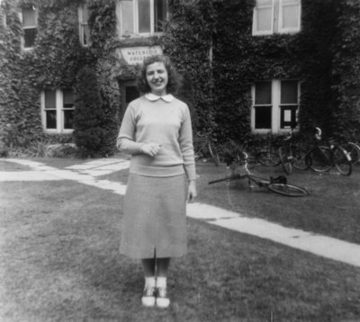 Student in front of Willison Hall, Waterloo College