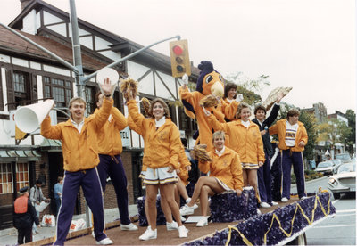 Wilfrid Laurier University cheerleaders riding on parade float