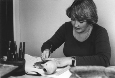 Woman working with archaeological tools