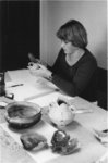 Woman working with archaeological tools