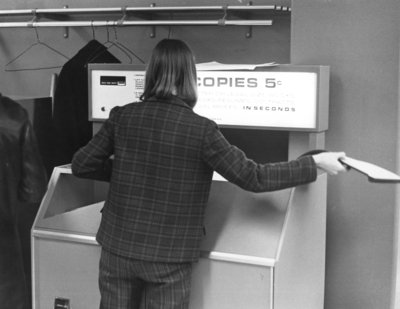 Waterloo Lutheran University student using a photocopier