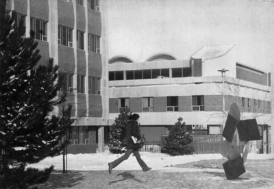 Man running on Wilfrid Laurier University campus