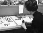 Waterloo Lutheran University student working with artifacts