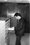 Man using card catalogue in Waterloo Lutheran University Library