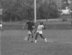 Two men playing soccer at Wilfrid Laurier University