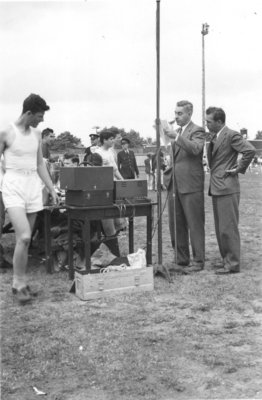 Man using public address system, Waterloo College Invitation Games, 1947