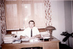 Erich Schultz sitting at desk