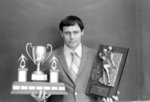 Glenn R. Baker with football awards