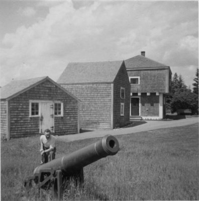 Don McNaughton standing with cannon