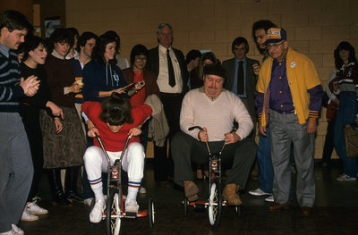 Tuffy Knight competing in tricycle event at Winter Carnival