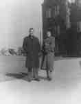 James Clark and Flora Roy standing in front of  Willison Hall, Waterloo College
