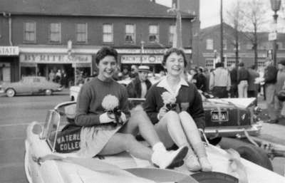 Waterloo College cheerleaders in Homecoming Parade, 1957