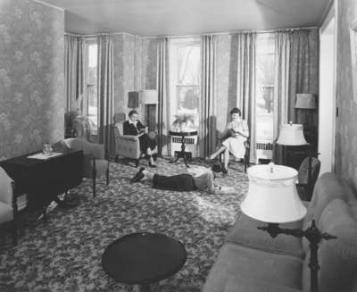 Three female Waterloo College students in Conrad Hall