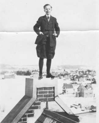 Fred Janzen standing on the roof of Willison Hall