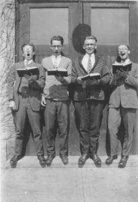 Four Waterloo College students singing