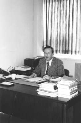 Frank Turner sitting in an office