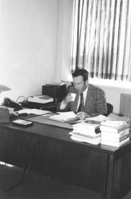 Frank Turner sitting in an office