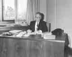 Lloyd Schaus sitting at a desk