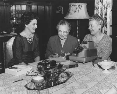 Women's Auxiliary members using a slide projector