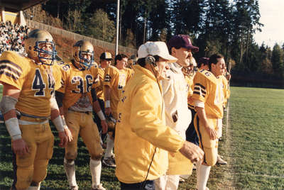 Rich Newbrough and football players during 1987 Western Bowl