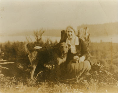 Mrs. DePencier and her dog "Major" on Baby Mountain (later Sentinel Hill)