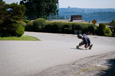 Longboarder at Queens & 12th