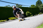 Longboarder at Queens & 12th