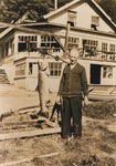 Dan Sewell weighing a salmon outside Whytecliff Lodge