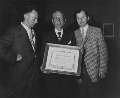 Tom Sewell & Joe Troll Presenting Plaque