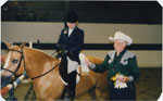 George Thompson presenting ribbons at a horse show