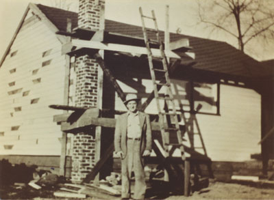 Harry Milner working on building behind current rectory of St. Anthony's Roman Catholic Church