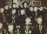 Eta Herchenrath, Cubmaster, and her cub group in St. Anthony's Church Hall