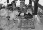 Children Working on a Puzzle