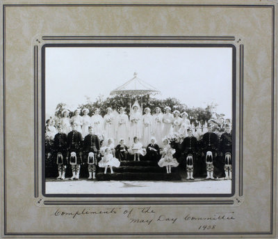 Group photograph of May Day celebration and ceremony platform, 1938.  May Queen, Gladys Wilson, Royal Chancellors, Ian MacDonald (left), Albert Fletcher (right) and others.