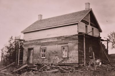 Rebuilding of Farmhouse on University Ave. with Roof