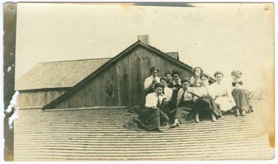 Women Sitting on Roof