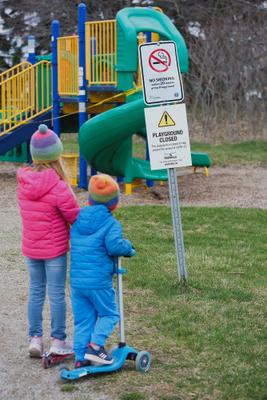 Children Looking at Closed Playground