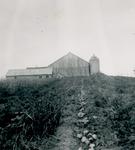 Farmhouse at the top of a hill