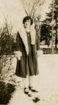 Woman standing outside in snow