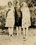 Three women standing outside