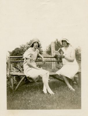 Two women sitting on a bench