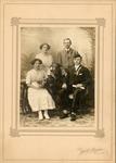 Two women and two men posing for a photograph