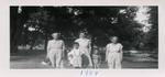 A group of three women and three children in a park