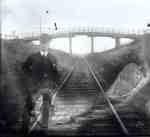 Man Standing on Railroad Tracks