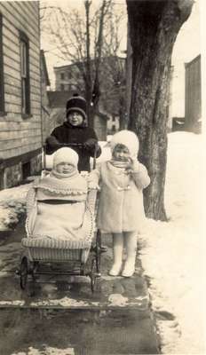 Two Children and Baby in Carriage