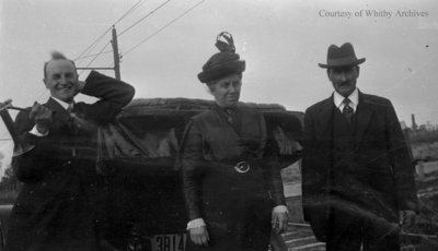 Three People Standing At The Back Of A Car, c.1915