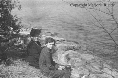 Unidentified Women Sitting By A Lake, April 27, 1941