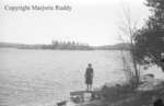 Unidentified Woman Standing By A Lake, April 27, 1941