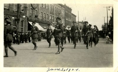 Soldiers marching in parade to dedicate Whitby Cenotaph